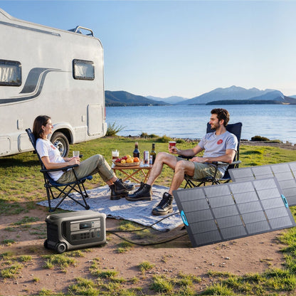 Anker SOLIX F3000 Portable Power Station charging via solar panel while two people enjoy drinks nearby